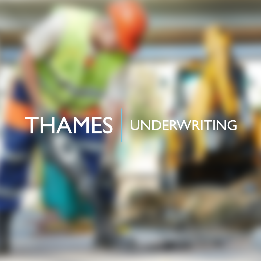 bespoke website design - blurry close up of a construction worker with 'Thames Underwriting' written in white writing